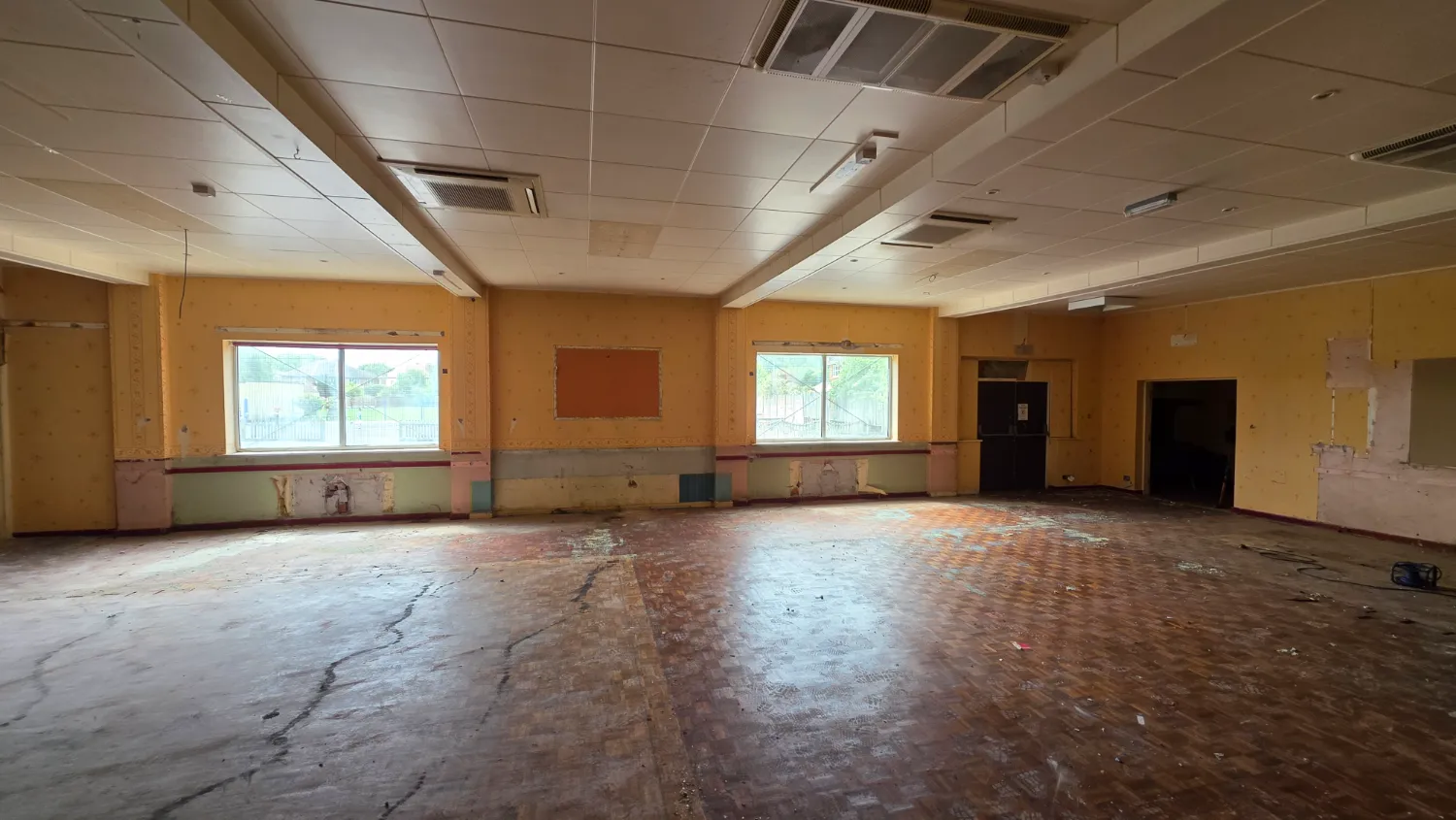 Sequence of works 3&ndash;5: the function rooms before works and during soft strip preparation — St Patrick's licensed asbestos removal project, Southport