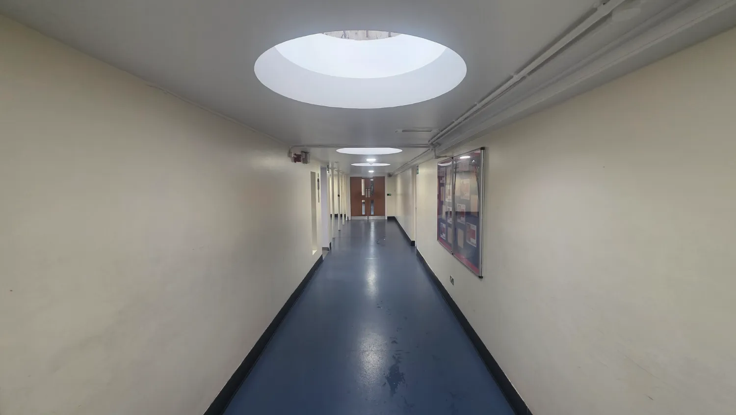 The main school corridor above the underground heating duct at the Warrington high school
