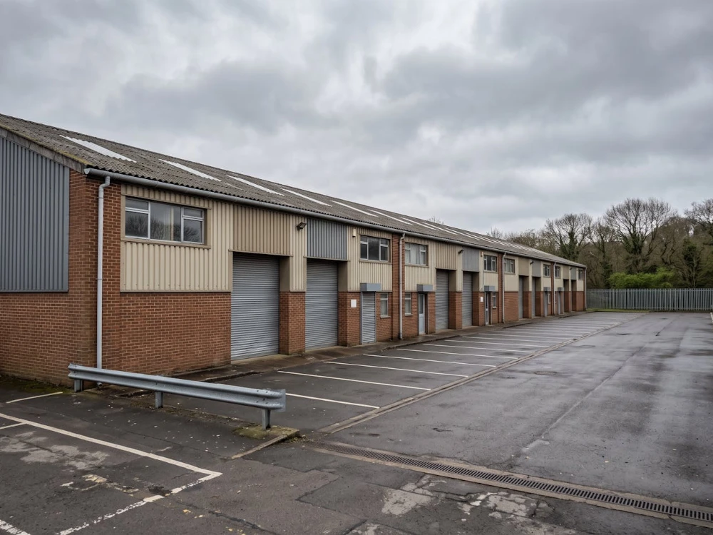 Row of 1980s commercial units on a UK industrial estate with profiled metal roof sheeting