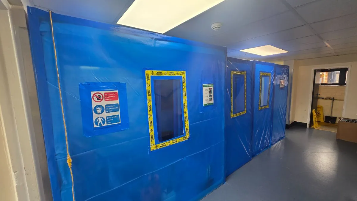 Cardinal Newman High School — enclosure wall with viewing panels and warning signage — Innov8 UK Group