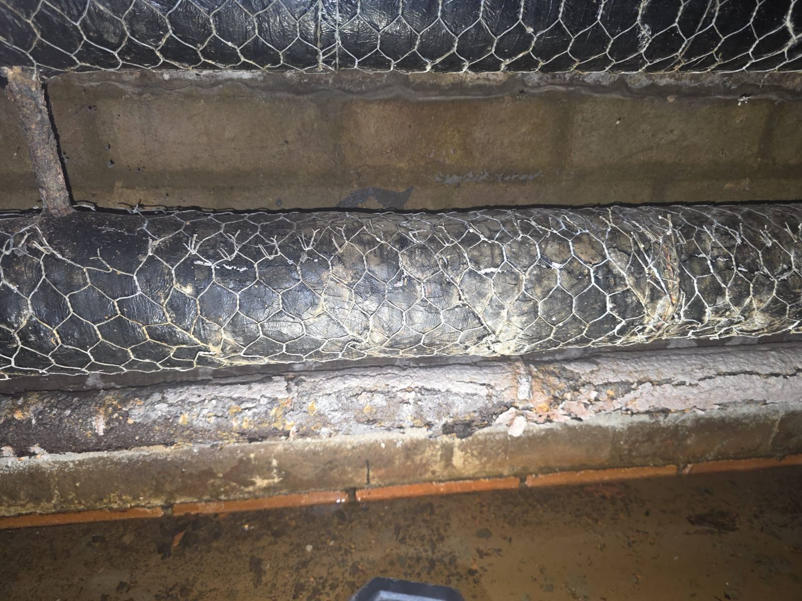 Cardinal Newman High School — pipe runs along both banks of the 1-metre-high duct before removal — Innov8 UK Group