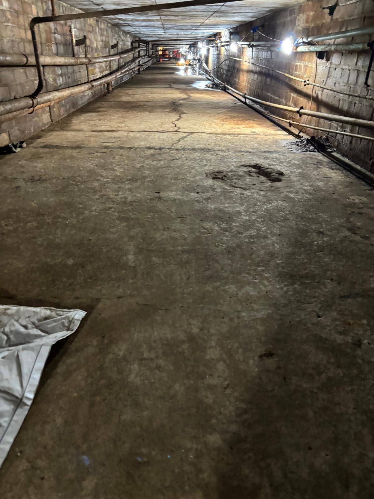 Cardinal Newman High School — inside the duct during the works with festoon lighting rigged — Innov8 UK Group