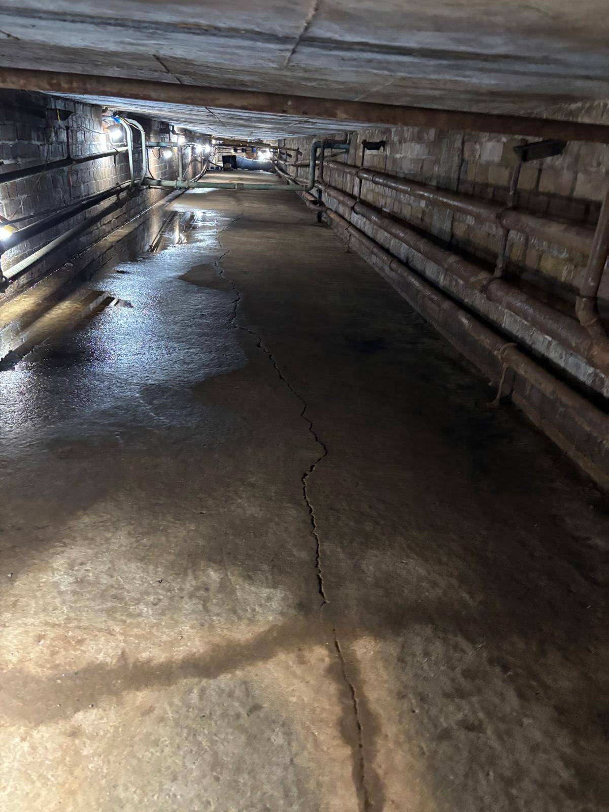 Cardinal Newman High School — duct mid-removal with task lighting and winch line in place — Innov8 UK Group