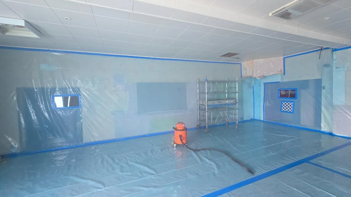 200m² AIB function room ceiling removal at St Patrick’s Social Club — on-site photo 1 — Innov8 UK Group