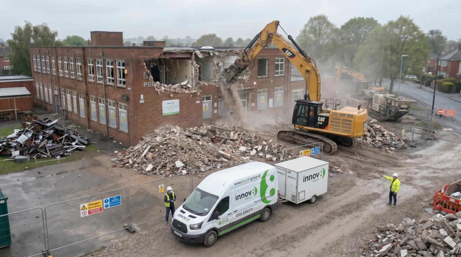 Excavator taking down structure